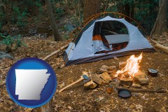 arkansas map icon and camping tent at a wilderness campsite