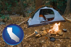 california map icon and camping tent at a wilderness campsite