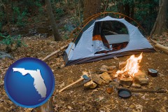 florida map icon and camping tent at a wilderness campsite