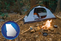 georgia map icon and camping tent at a wilderness campsite