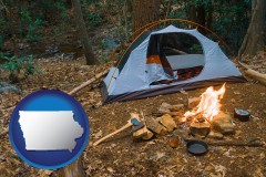 iowa map icon and camping tent at a wilderness campsite