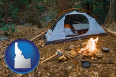 idaho map icon and camping tent at a wilderness campsite