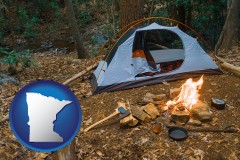 minnesota map icon and camping tent at a wilderness campsite