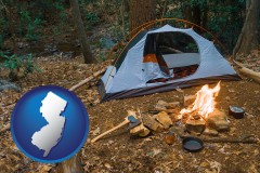 new-jersey map icon and camping tent at a wilderness campsite