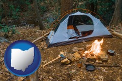 ohio map icon and camping tent at a wilderness campsite