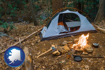 camping tent at a wilderness campsite - with Alaska icon