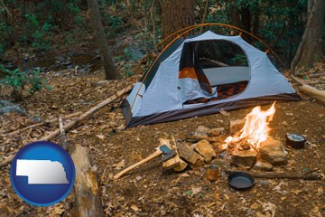 camping tent at a wilderness campsite - with Nebraska icon
